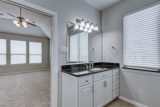 bathroom with visible vents, baseboards, ceiling fan, and vanity