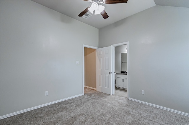 unfurnished room featuring lofted ceiling, ceiling fan, and light carpet