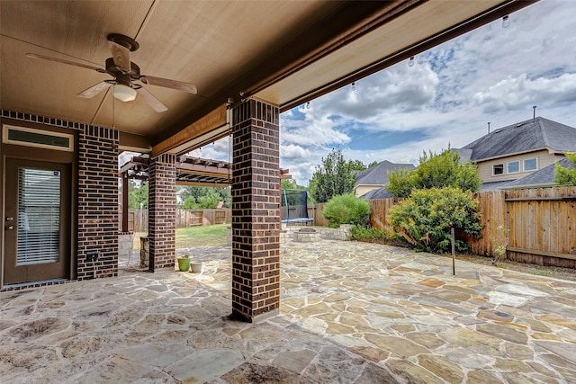 view of patio featuring ceiling fan