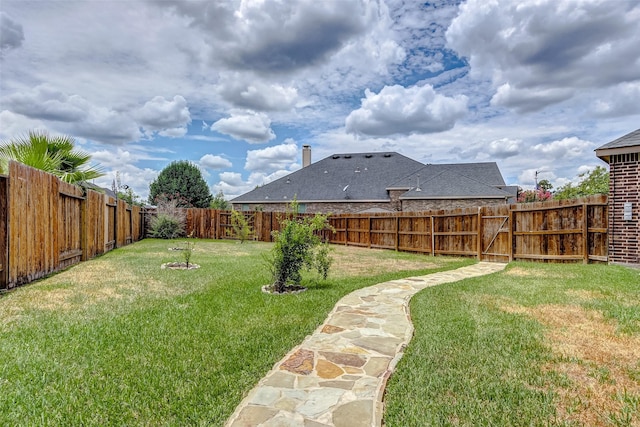 view of yard featuring a fenced backyard