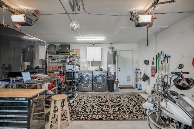 garage featuring a garage door opener, water heater, and washing machine and clothes dryer