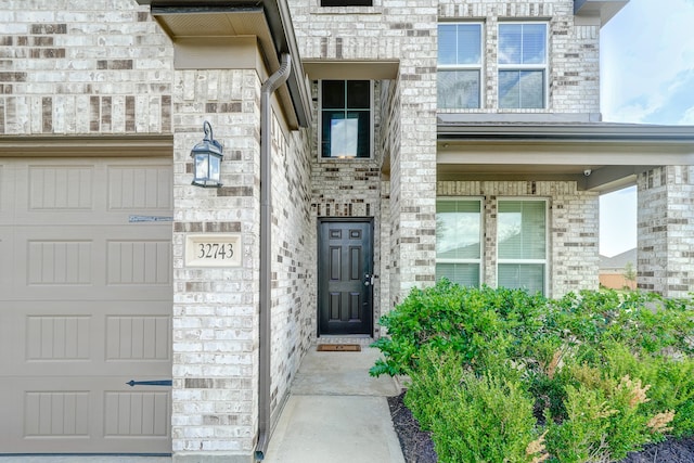 entrance to property featuring a garage