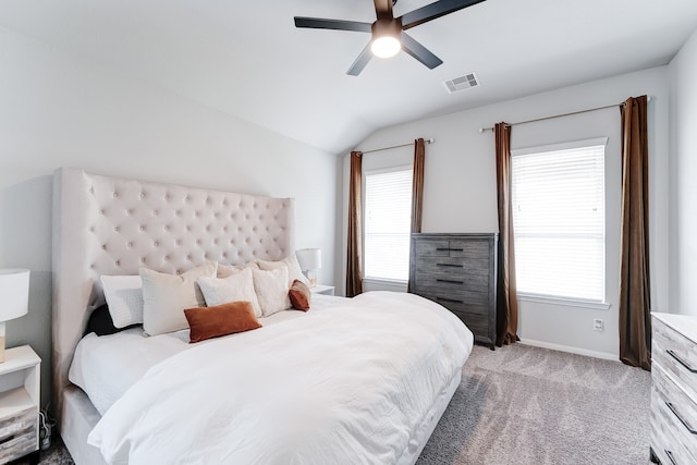 bedroom with ceiling fan, light carpet, and vaulted ceiling