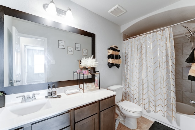 full bathroom with shower / bath combo, tile patterned flooring, toilet, and vanity