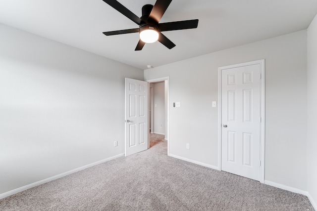 unfurnished bedroom featuring carpet flooring and ceiling fan