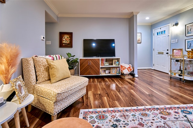 living room featuring crown molding and dark hardwood / wood-style floors