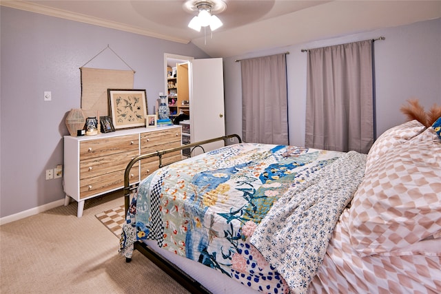 bedroom with ceiling fan, crown molding, and light carpet