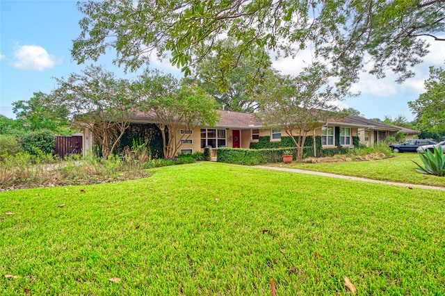 single story home with a front yard