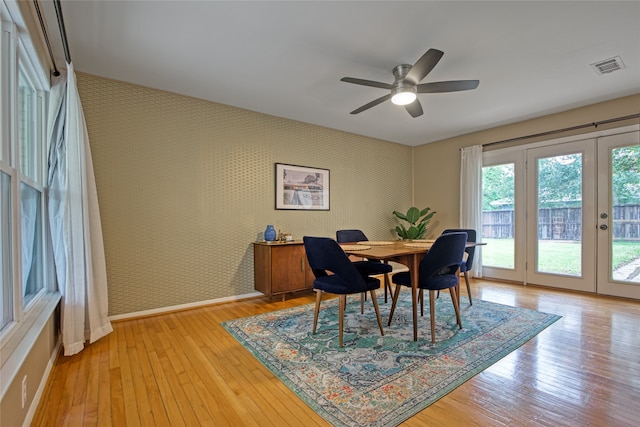 dining room featuring french doors, ceiling fan, and light hardwood / wood-style flooring