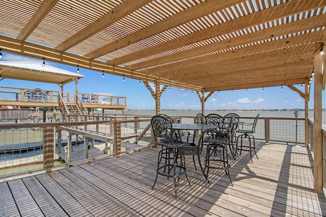 3821 Nasa Rd Unit 1, Seabrook, TX 77586 - deck with a pergola, a water view, and outdoor dining area