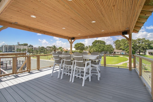 3821 Nasa Rd Unit 1, Seabrook, TX 77586 - wooden terrace featuring a lawn and outdoor dining space
