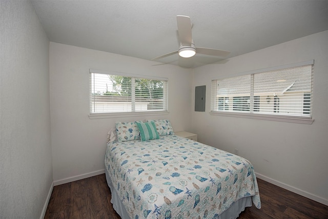 3821 Nasa Rd Unit 1, Seabrook, TX 77586 - bedroom with wood finished floors, electric panel, and a ceiling fan