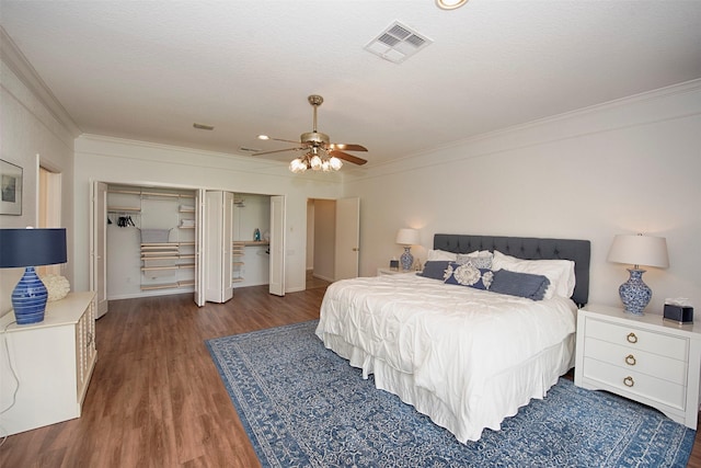 3821 Nasa Rd Unit 1, Seabrook, TX 77586 - bedroom with crown molding, wood finished floors, ceiling fan, and two closets