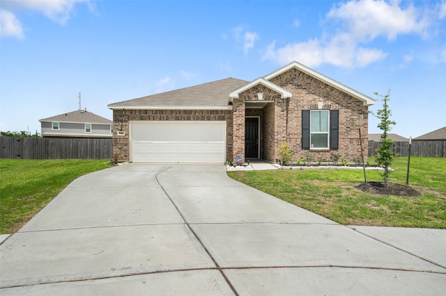 view of front of home with a front yard and a garage