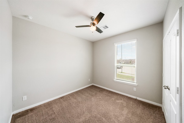 empty room with carpet and ceiling fan