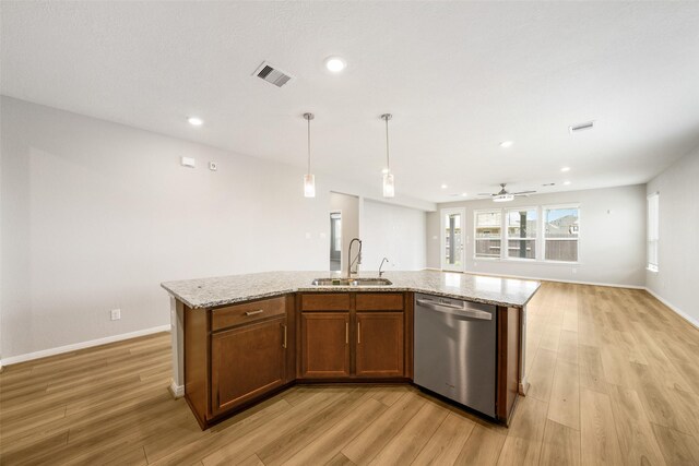 kitchen featuring an island with sink, dishwasher, ceiling fan, and sink