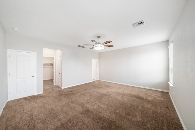 empty room featuring light colored carpet and ceiling fan