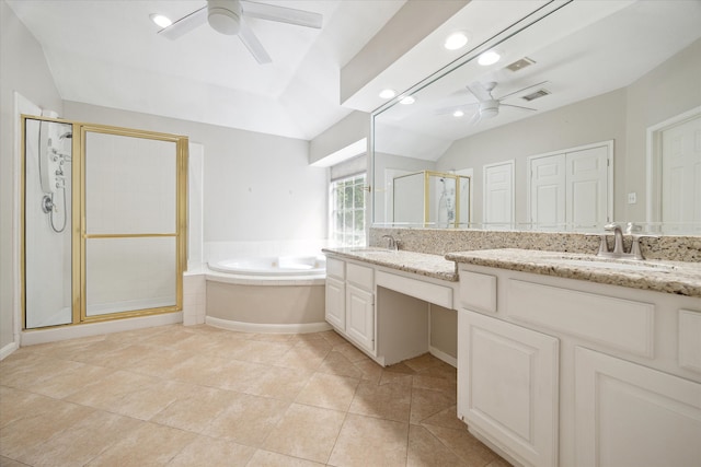 bathroom featuring vanity, shower with separate bathtub, tile patterned floors, and vaulted ceiling