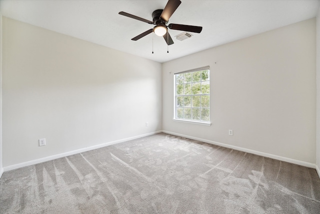 unfurnished room with carpet and ceiling fan