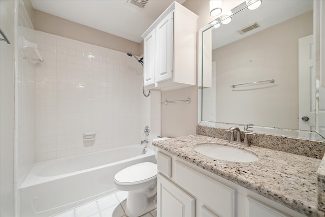 full bathroom with vanity, toilet, tile patterned floors, and tiled shower / bath combo