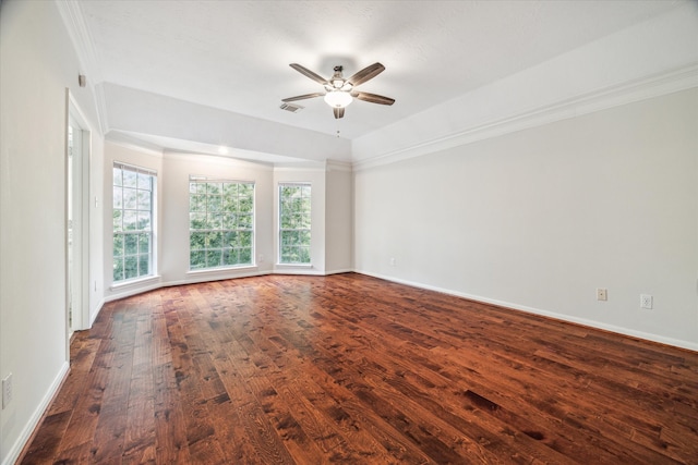 spare room with ceiling fan, ornamental molding, and dark hardwood / wood-style floors