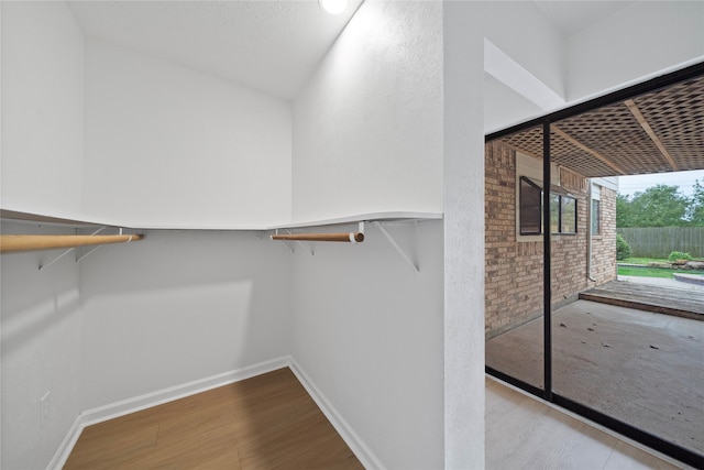 spacious closet with light hardwood / wood-style floors