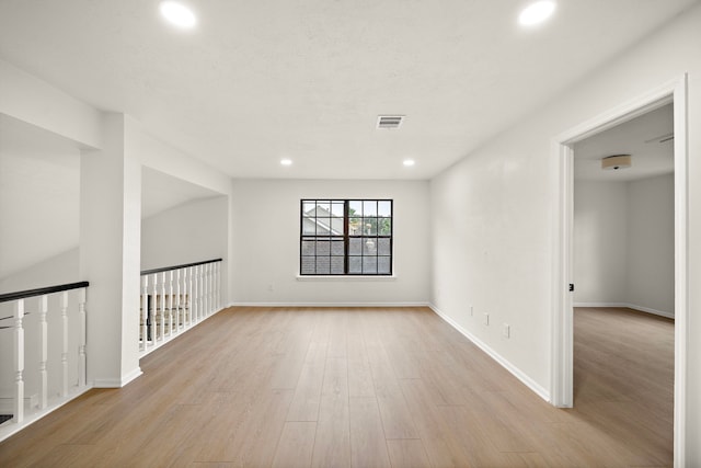 spare room featuring light wood-type flooring