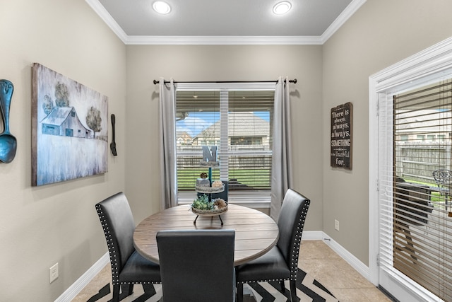 tiled dining space featuring ornamental molding