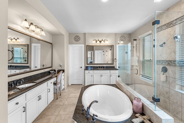 bathroom with vanity, plus walk in shower, and tile patterned floors