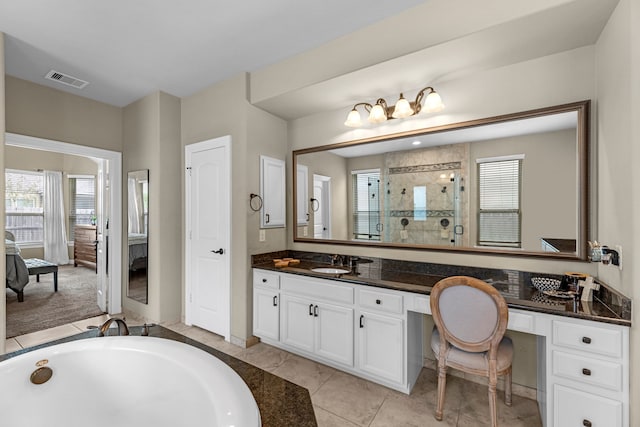 bathroom featuring vanity, plus walk in shower, and tile patterned floors