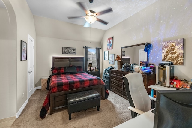 bedroom featuring light carpet, lofted ceiling, and ceiling fan