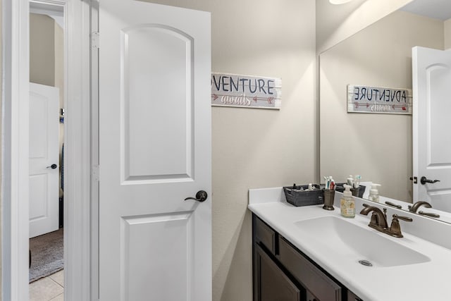 bathroom with tile patterned flooring and vanity