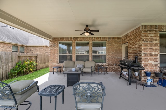 view of patio with area for grilling, outdoor lounge area, and ceiling fan