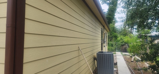 view of property exterior with central AC unit