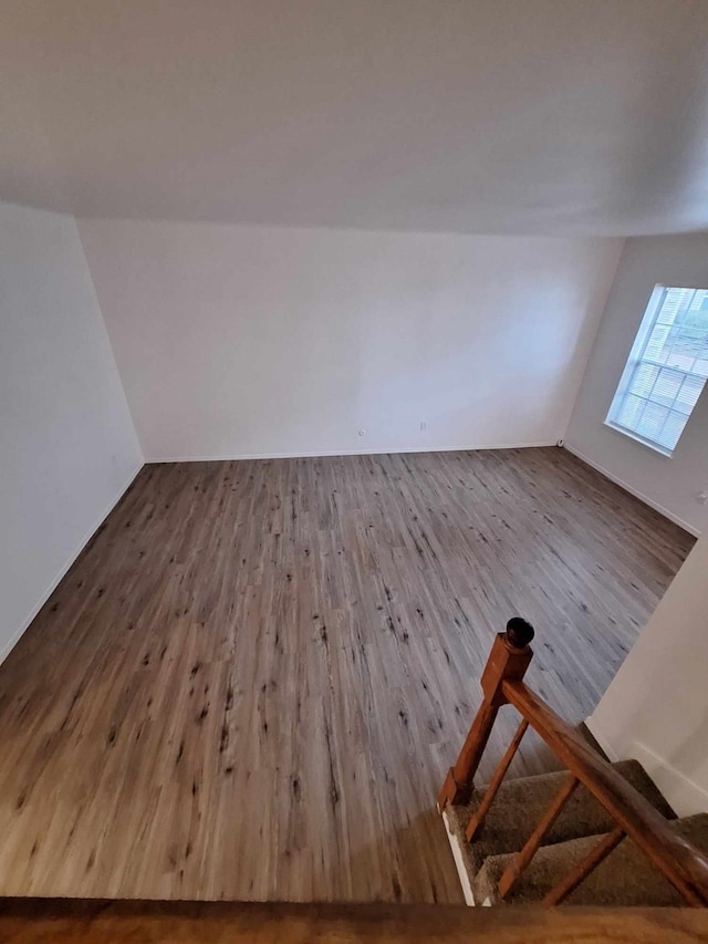 additional living space featuring hardwood / wood-style flooring