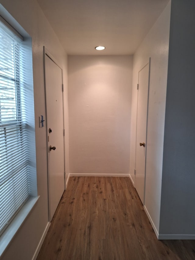 entryway with dark hardwood / wood-style flooring