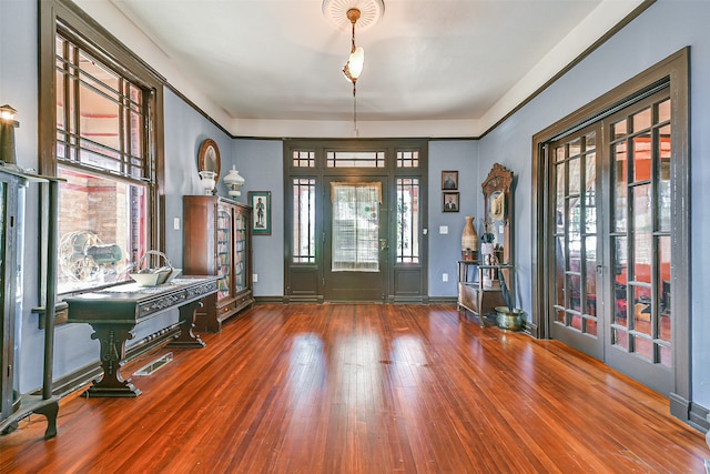 entryway featuring french doors, dark hardwood / wood-style flooring, and plenty of natural light