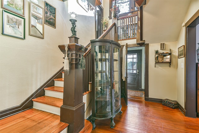 stairs featuring hardwood / wood-style flooring