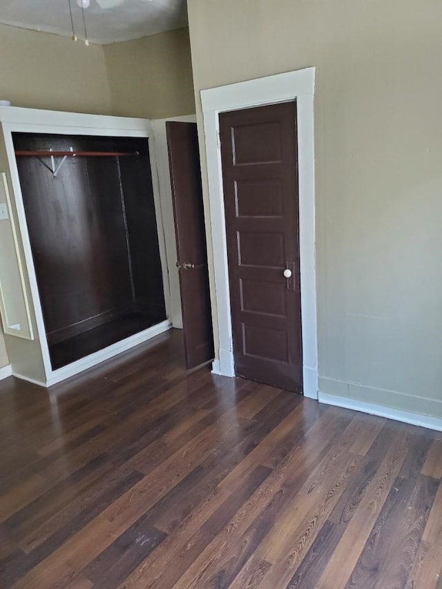 interior space featuring dark hardwood / wood-style flooring and a closet