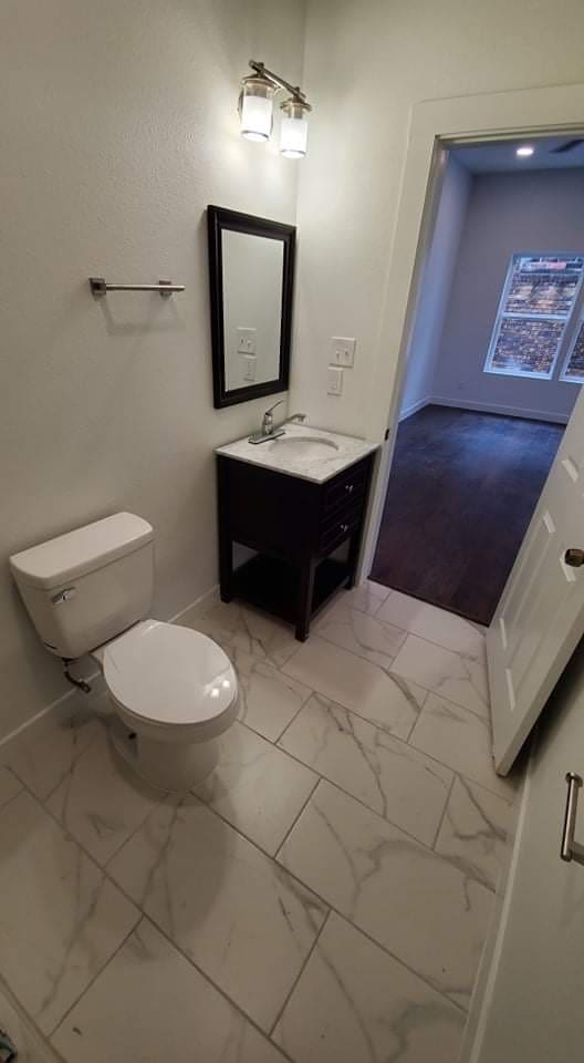 bathroom with vanity and toilet