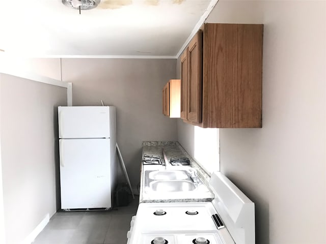 kitchen featuring sink and white refrigerator