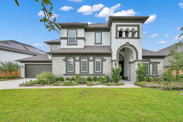 view of front of home featuring stucco siding, concrete driveway, a garage, stone siding, and a front lawn