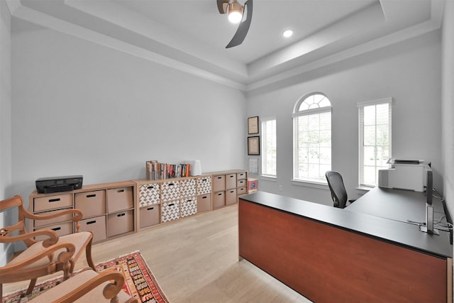 office area featuring light wood-type flooring, a tray ceiling, ceiling fan, and recessed lighting