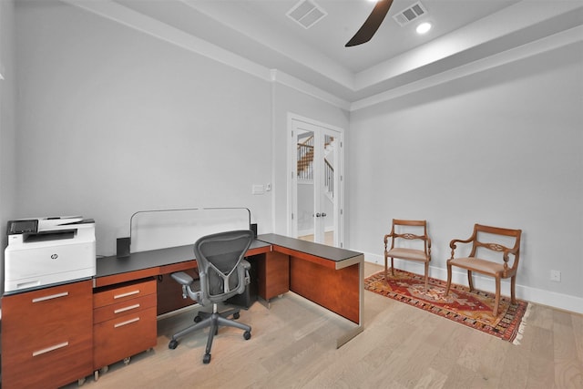 office space with light wood-style floors, baseboards, visible vents, and french doors