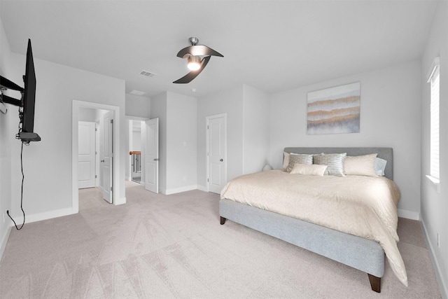 bedroom featuring a ceiling fan, baseboards, visible vents, and carpet flooring