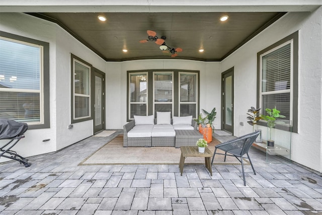 view of patio / terrace with ceiling fan and an outdoor living space