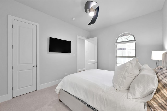 bedroom with carpet, baseboards, and a ceiling fan