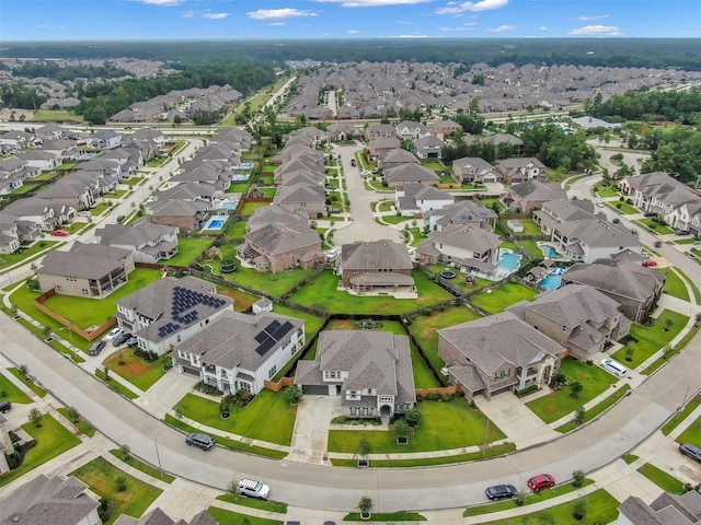 birds eye view of property with a residential view