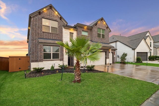 view of front of house with a lawn and a garage