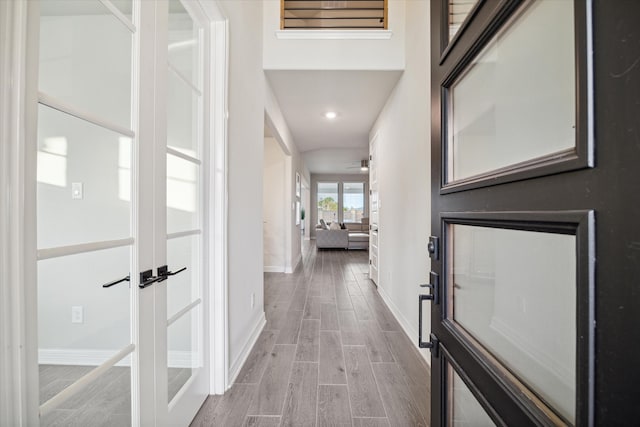 hall with light wood-type flooring